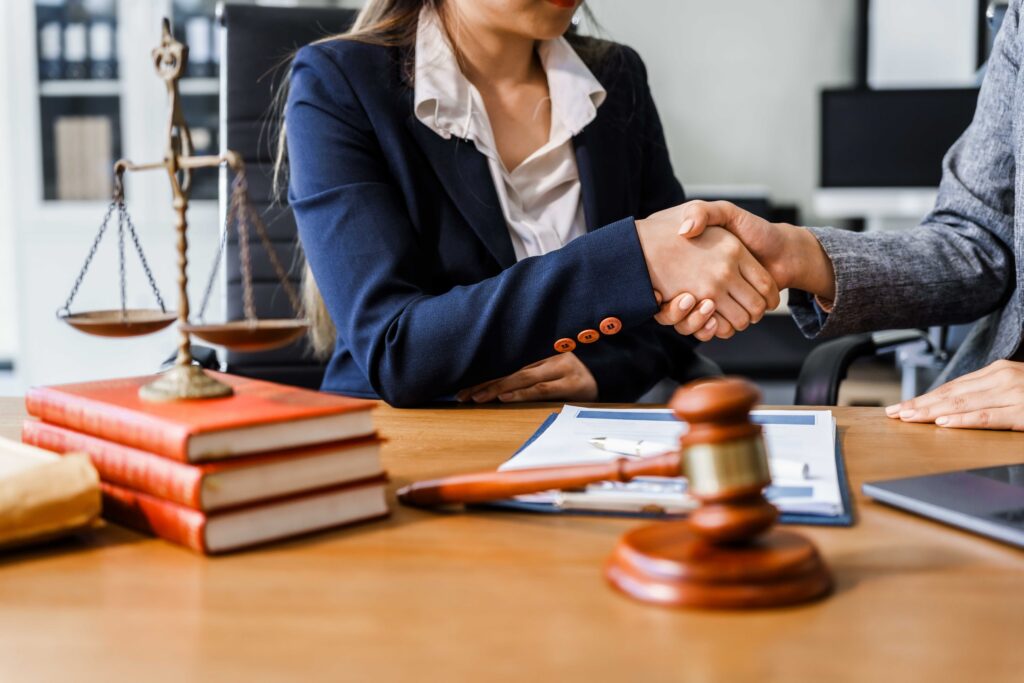 Attorney reviewing case documents at a desk