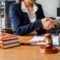 Attorney reviewing case documents at a desk Attorney reviewing case documents at a desk